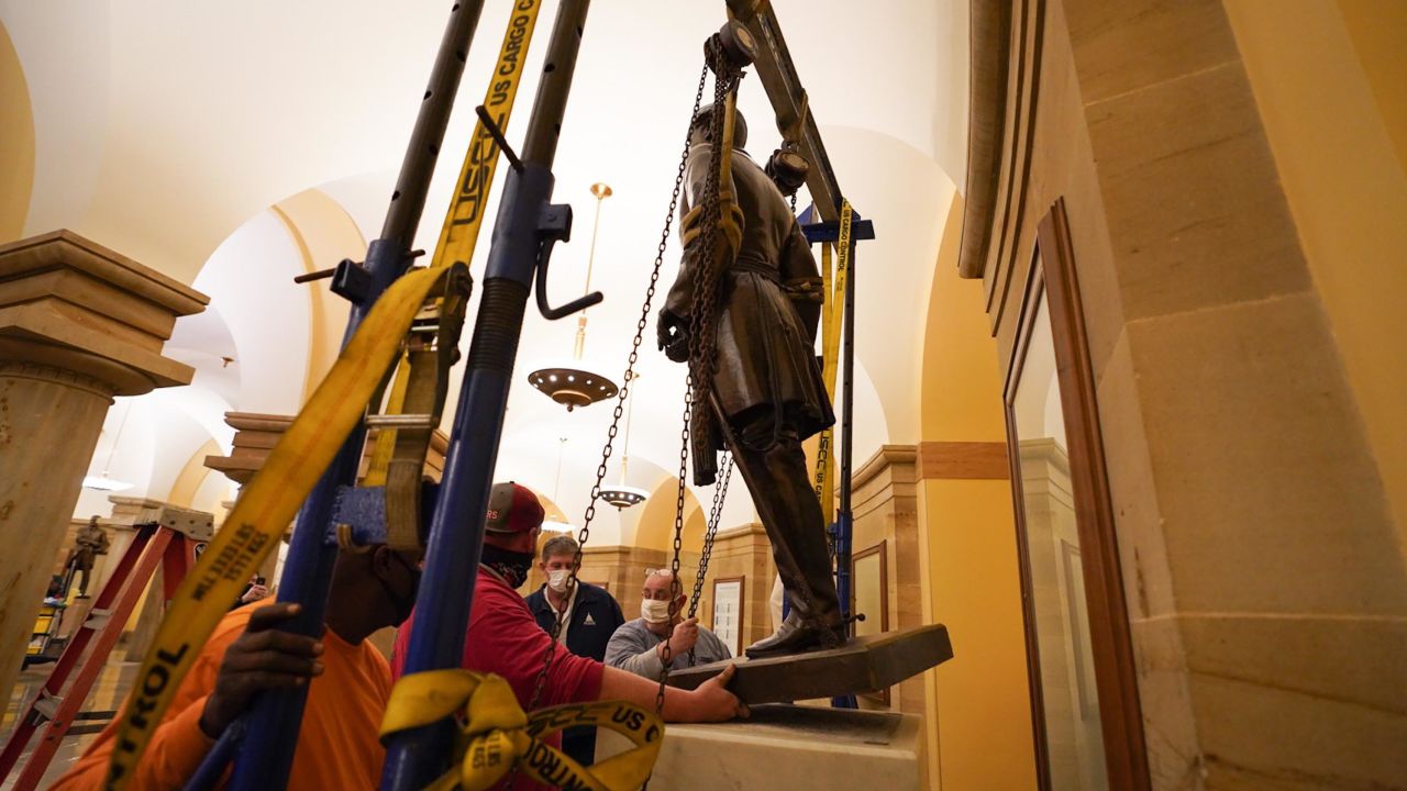 Workers remove Virginia's statue of Confederate Gen. Robert E. Lee from the Crypt of the US Capitol. 