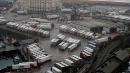Lorries are parked near the port, Monday, Dec. 21, 2020, after the Port of Dover, England, was closed and access to the Eurotunnel terminal suspended following the French government's announcement. France banned all travel from the UK for 48 hours from midnight Sunday, including trucks carrying freight through the tunnel under the English Channel or from the port of Dover on England's south coast. (AP Photo/Kirsty Wigglesworth)
