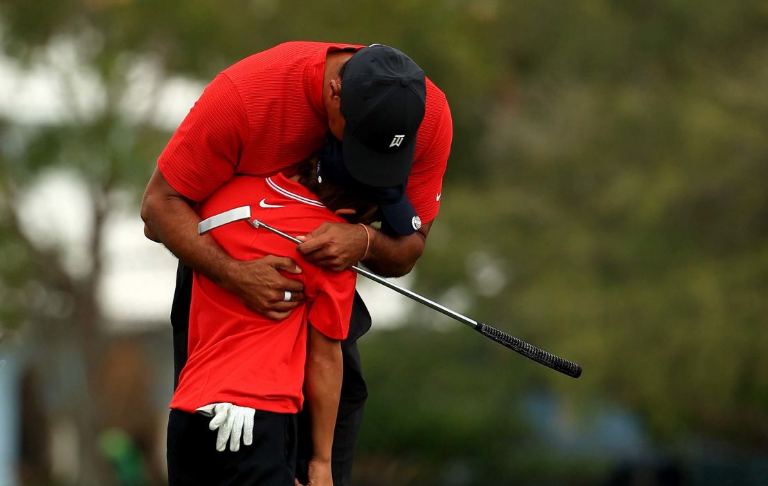 Tiger Woods hugs his son Charlie  on the 18th hole after the final round of the PNC Championship.