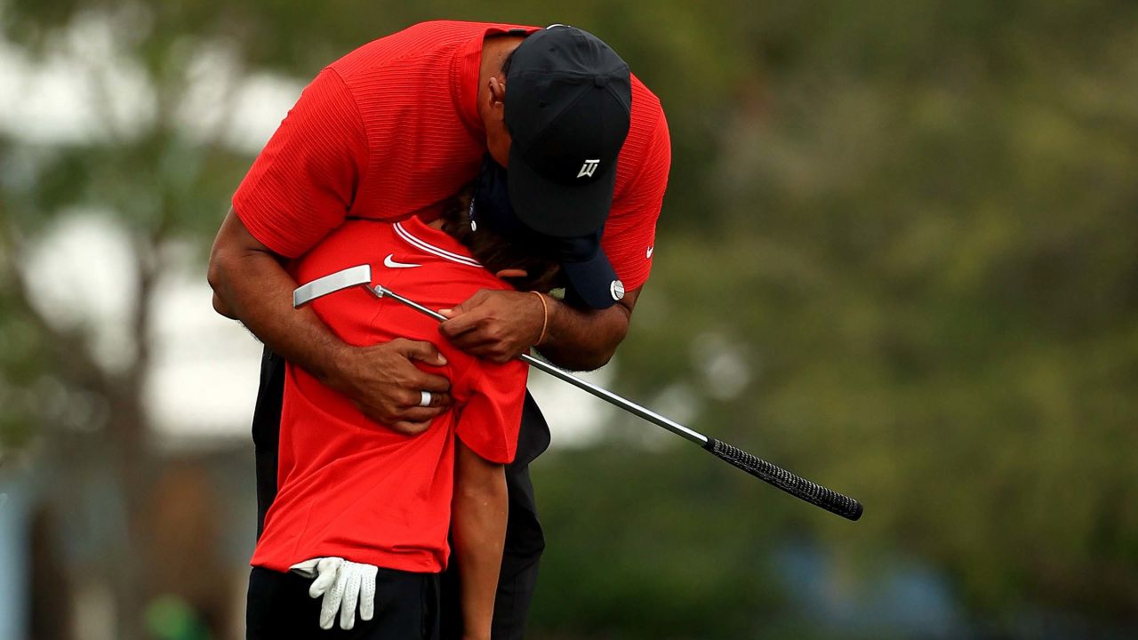 Tiger Woods hugs his son Charlie on the 18th hole after the final round of the PNC Championship.