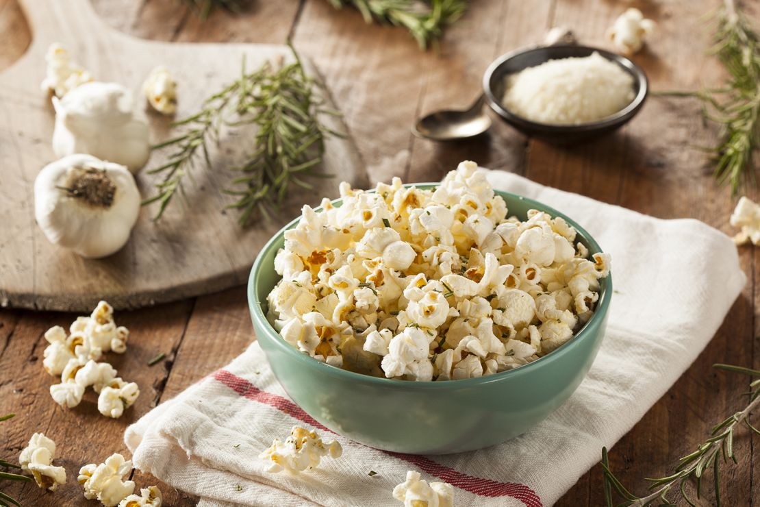 To accompany holiday movie watching, a bowl of hot popcorn with freshly grated Parmesan is just the ticket.