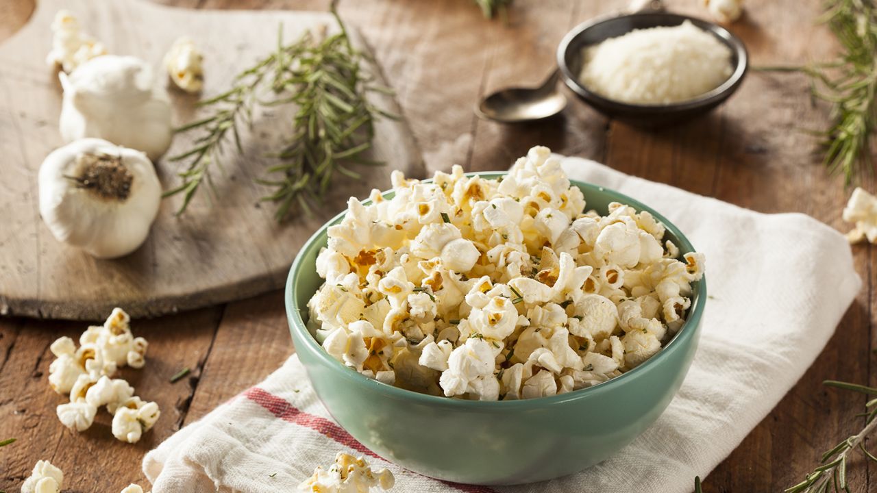 To accompany holiday movie watching, a bowl of hot popcorn with freshly grated Parmesan is just the ticket.