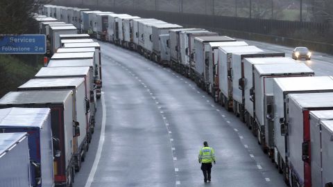 Police patrol along the M20 motorway where freight traffic is parked whilst the port of Dover remains closed on Tuesday.