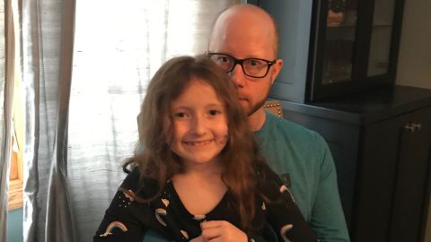 Bryan Clift with his daughter Iyla. Clift has been out of work since March and is behind on rent on his apartment in the suburbs of Minneapolis. 