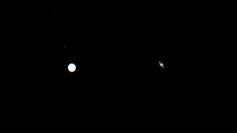 Jupiter, left, and Saturn are seen Monday in Santa Barbara, California.