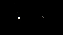 SANTA BARBARA, CALIFORNIA - DECEMBER 21: Jupiter (L) and Saturn appear about one-tenth of a degree apart during an astronomical event known as a Great Conjunction on December 21, 2020 in Santa Barbara, California. The planets, which remain about 450 million miles apart in space, have not appeared this close together from Earth's vantage point since 1623, and it's been nearly 800 years since the alignment occurred at night. The conjunction, which occurs on the night of the winter solstice by coincidence, has become known popularly as the "Christmas Star." The gas giants will not appear this close together again until 2080. (Photo by Rodin Eckenroth/Getty Images)