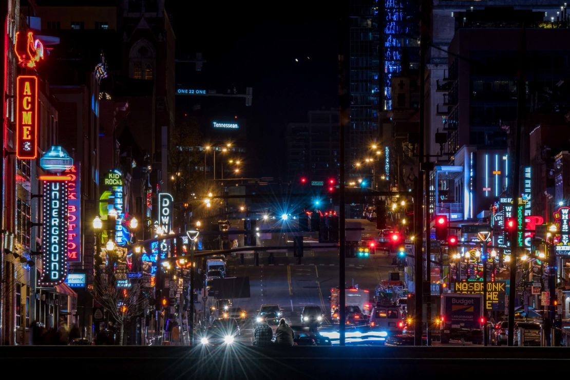 Saturn and Jupiter, top center, are seen in the sky over Broadway in downtown Nashville, Tennessee.