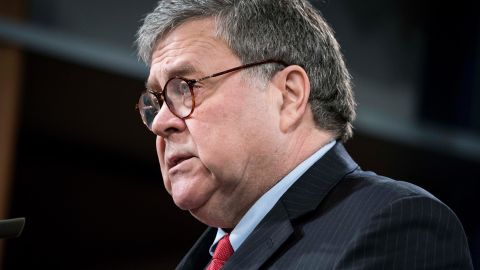 Then-Attorney General William Barr participates in a news conference at the Department of Justice along with DOJ officials in February 2020 in Washington, DC. 