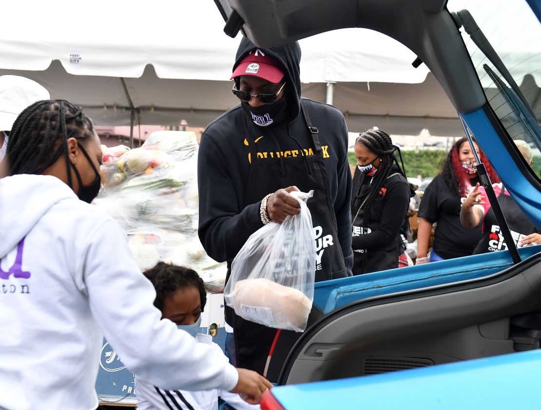 2 Chainz hosts a food drive in September in which volunteers handed out PPE and registered voters.