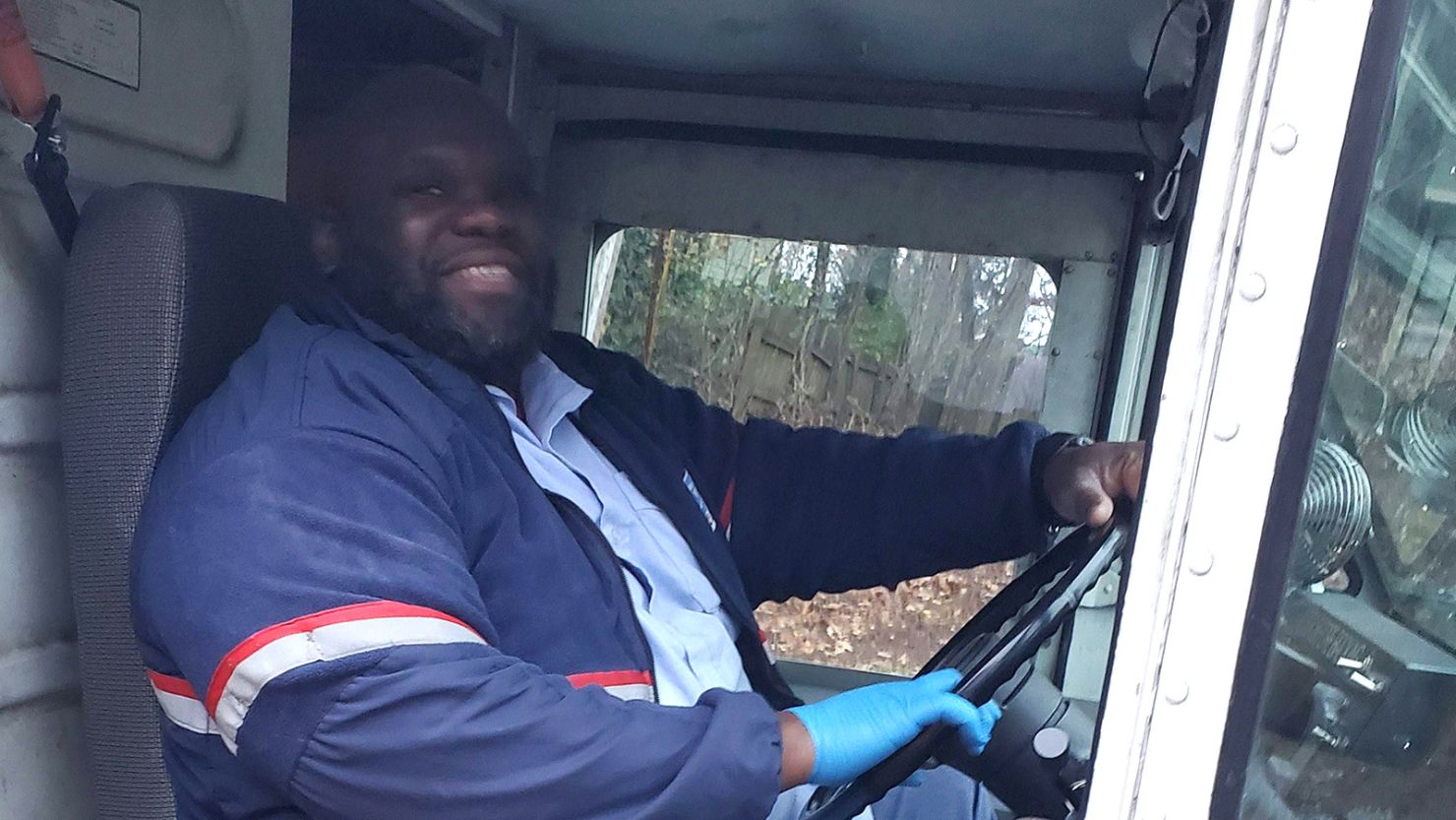 Mail carrier Adam Finley plays Tic-tac-toe with kids on his route.