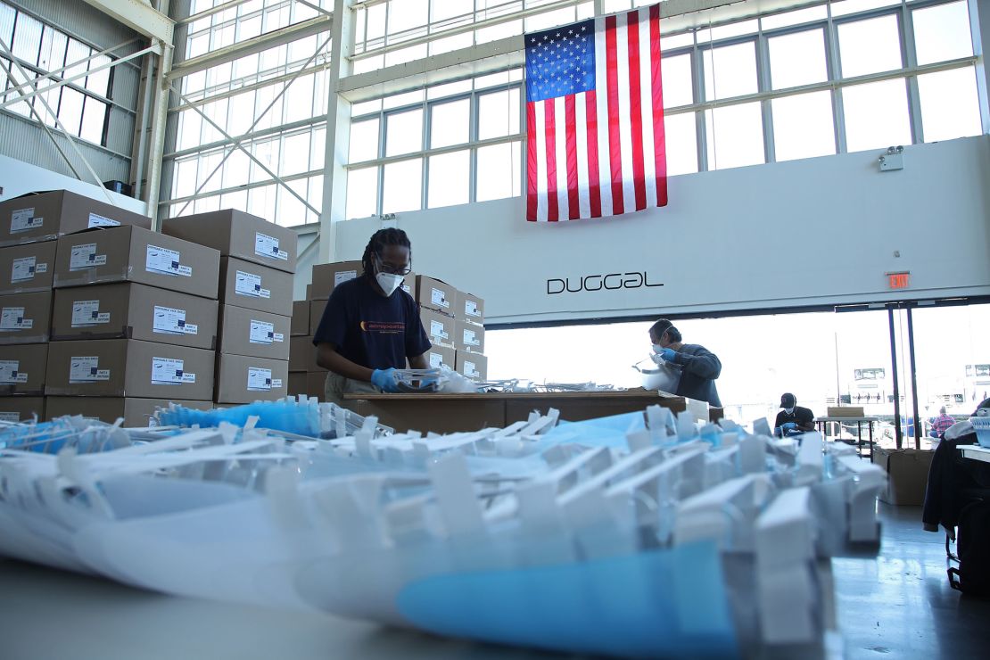 Workers assemble PPE for the first responders at the Duggal Greenhouse at the Brooklyn Navy Yard on April 28, 2020.