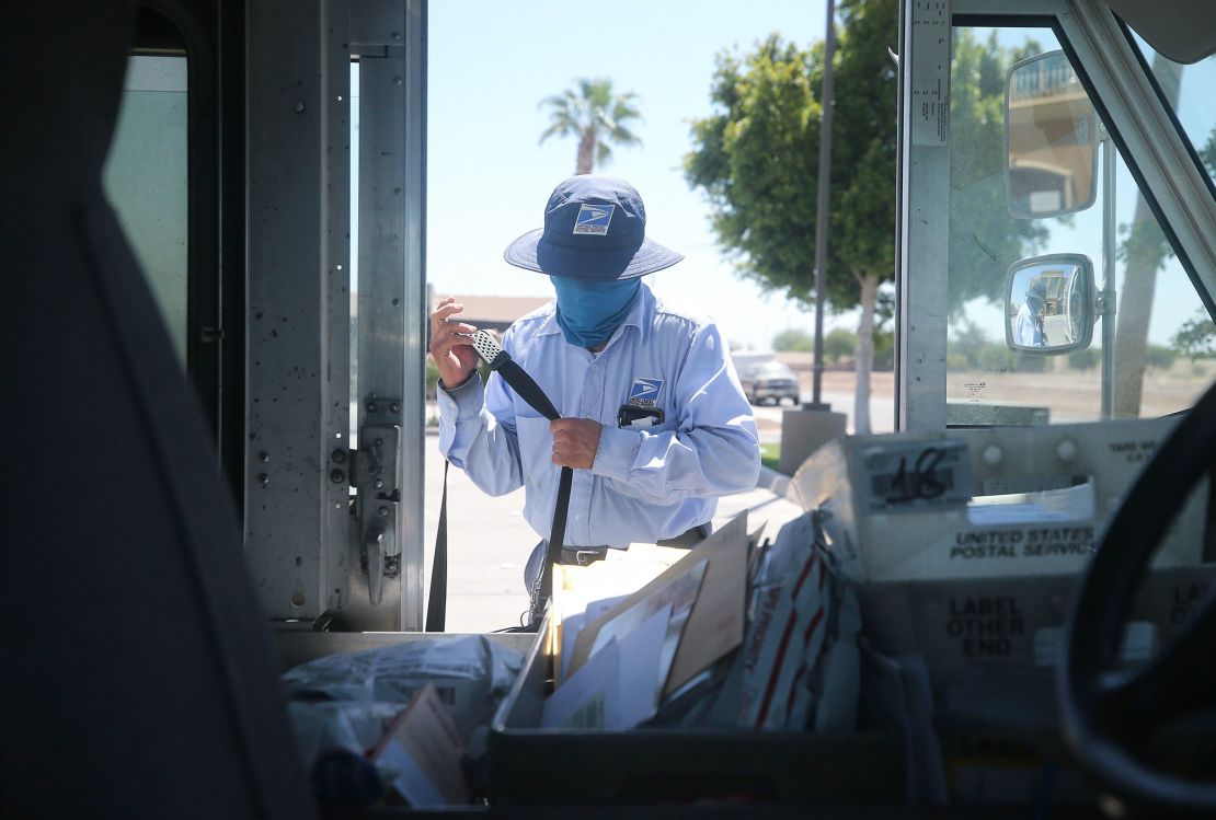 A postal worker wears a face mask during the Covid-19 pandemic.