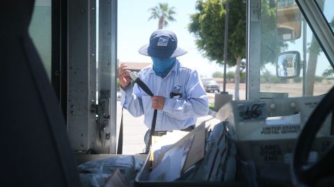 A postal worker wears a face mask during the Covid-19 pandemic.