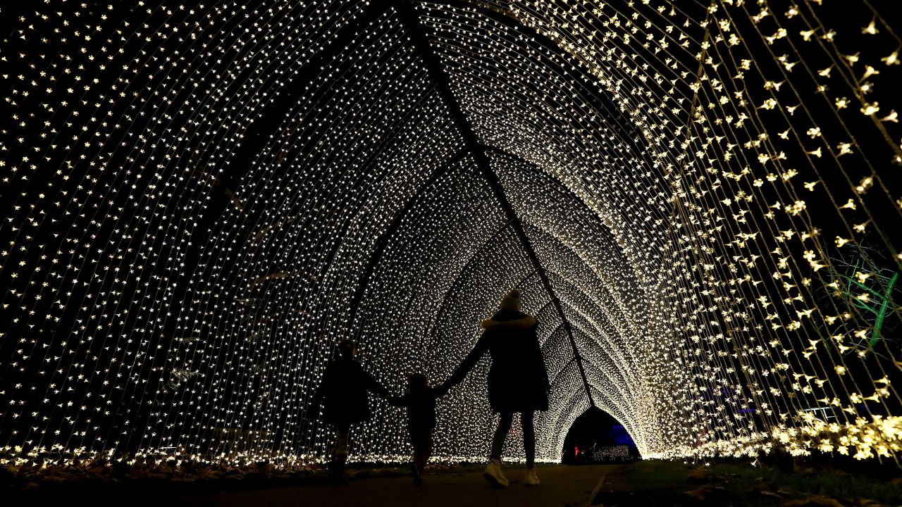 <strong>Kew Gardens, London: </strong>Revelers take in the after-dark trail lights at Christmas at Kew, an annual festive event held between December and January.