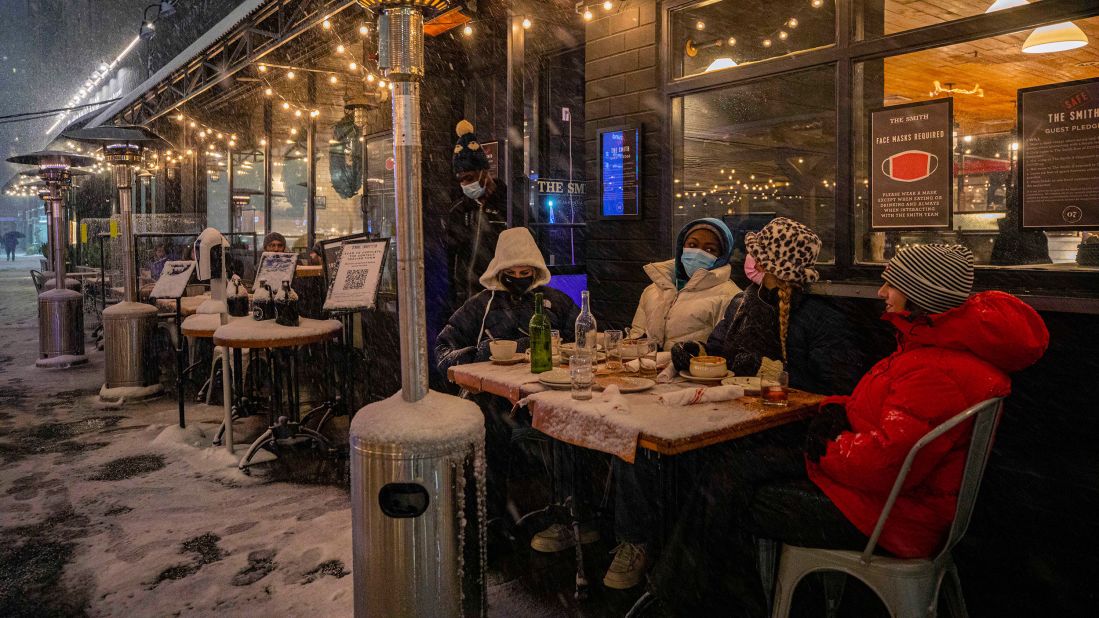 <strong>New York: </strong>Customers brave the cold while dining outside restaurants during a snowstorm in the Big Apple on December 16.