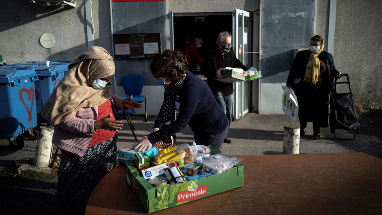 Volunteers of the charity Restos du Coeur distribute food in Toulouse, southern France in November.