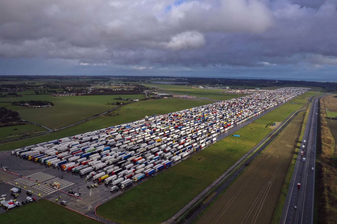 Semi-trailers are lined up at Manston airport on Wednesday, December 23, in the UK. <a href="https://www.cnn.com/2020/12/23/europe/uk-border-france-travel-ban-wednesday-intl-gbr/index.html" target="_blank">Thousands of stranded truck drivers</a> are waiting to cross the English Channel after France agreed to ease a blockade despite fears over a new Covid-19 variant, but the agreement requires people to have proof of a negative Covid-19 test conducted in the past 72 hours. 
