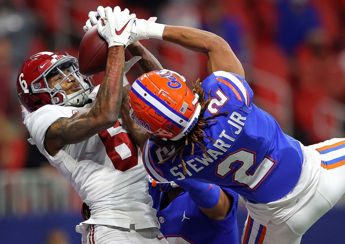 Florida's Brad Stewart Jr. and Donovan Stiner break up a pass intended for Alabama's DeVonta Smith during the first half of the SEC Championship at Mercedes-Benz Stadium on Saturday, December 19, in Atlanta. Alabama won 52-46.