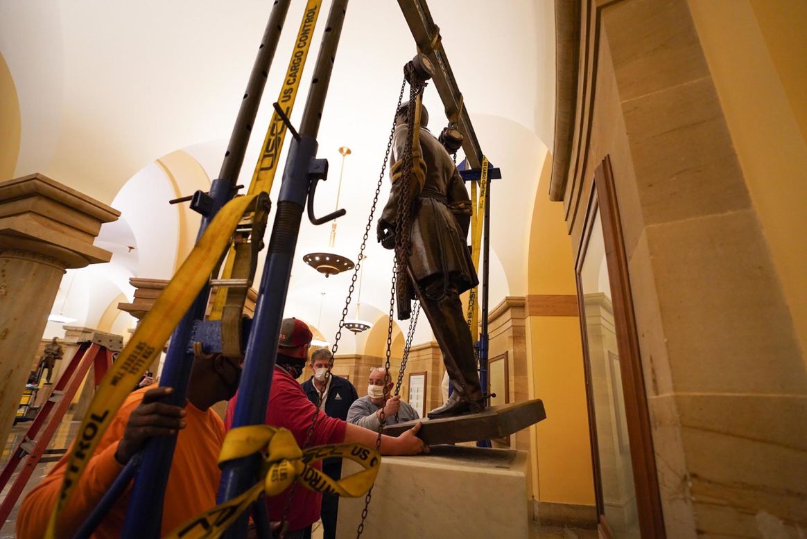 <a href="https://www.cnn.com/2020/12/21/politics/robert-e-lee-confederate-statue-us-capitol/index.html" target="_blank">Workers remove a statue</a> of Confederate Gen. Robert E. Lee from the US Capitol overnight on Sunday, December 20 in Washington. Lee's statue had been one of 13 statues in the Crypt of the Capitol, representing the 13 original colonies.