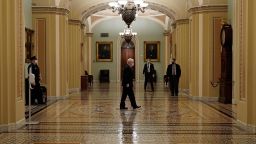U.S. Sen. Majority Leader Mitch McConnell (R-KY), walks from the Senate floor as both chambers of Congress are aimed to pass the coronavirus disease (COVID-19) package in a marathon session on Capitol Hill Washington, D.C., U.S., December 21, 2020. REUTERS/Ken Cedeno