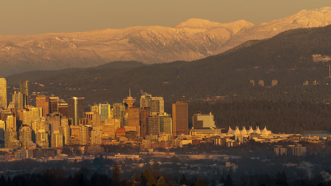 The sun rises over downtown Vancouver, Canada, on Tuesday, December 22.