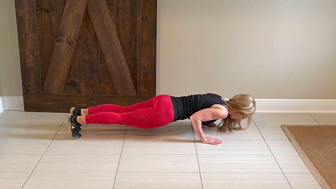 For proper push-up form, make sure your upper and lower body are straight to establish the plank position.
