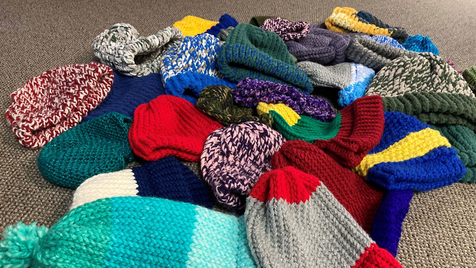 Toques made by the men in the knitting club.