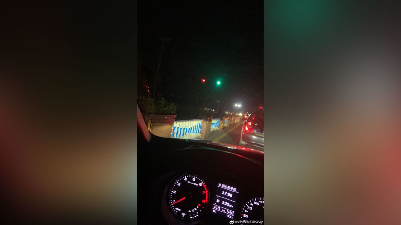 Yiwu residents drive in the dark as street lights are turned off to save energy.