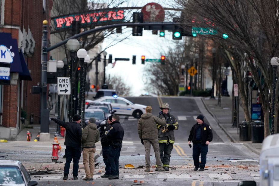 Emergency responders assess the damage near the scene.