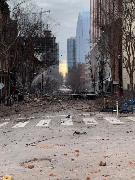 In this photo from the Nashville Fire Department, burned cars, charred branches and debris are seen spread across the street.