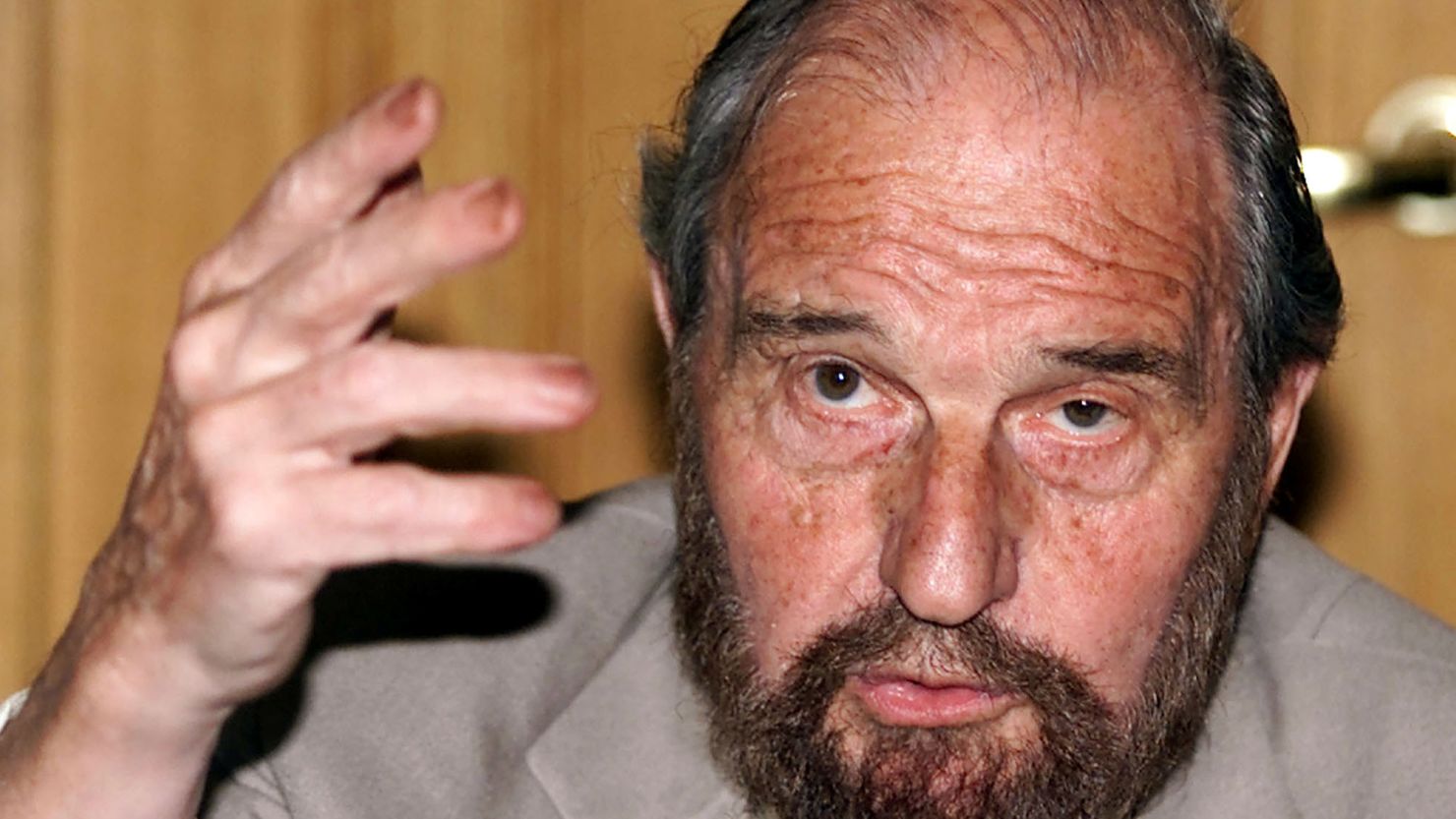 George Blake gestures as he speaks at a presentation of a book of letters written by other spies from British prison, in Moscow in June 2001. 