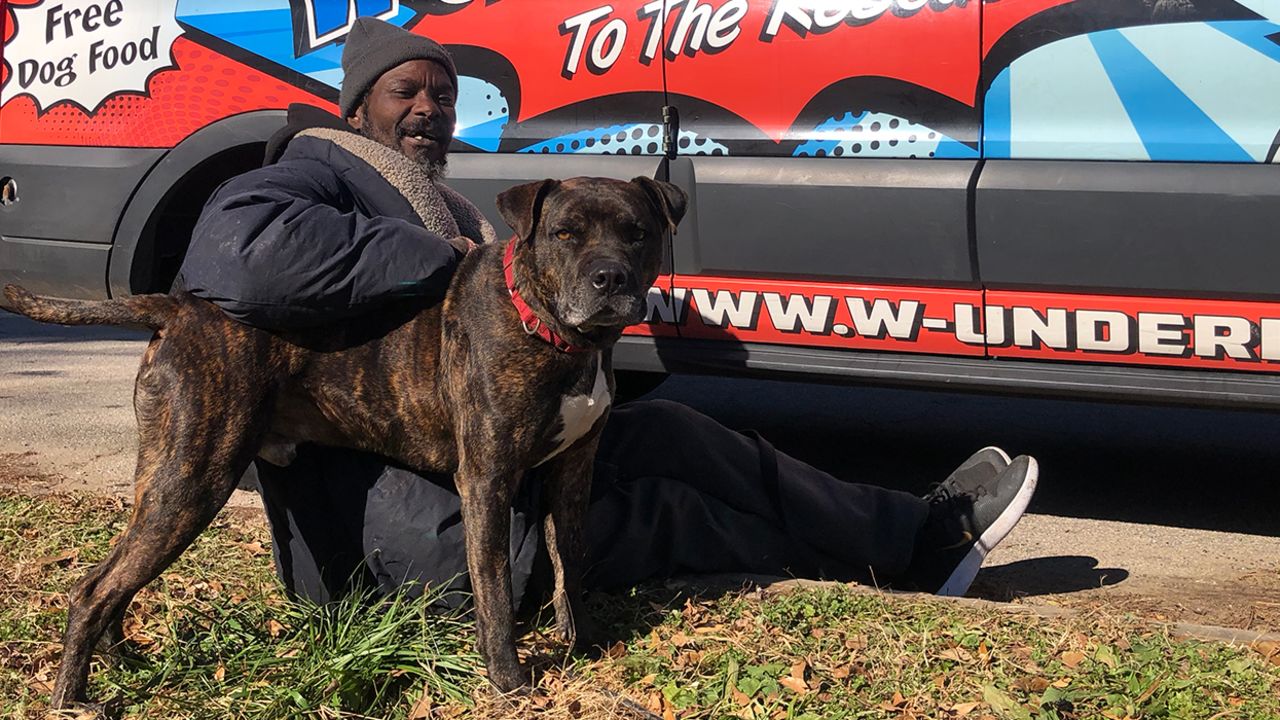 Keith Walker and Bravo, his pit bull.