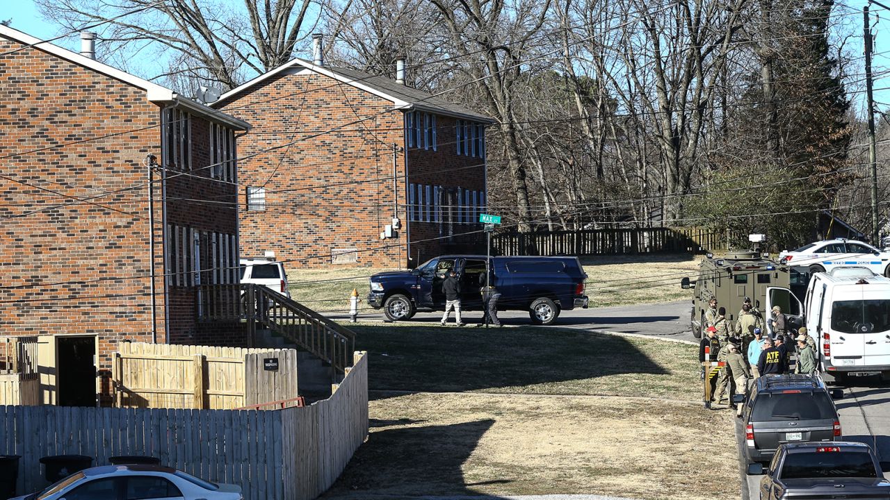 Law enforcement officers search a home in Antioch, Tennessee, on Saturday, December 26.