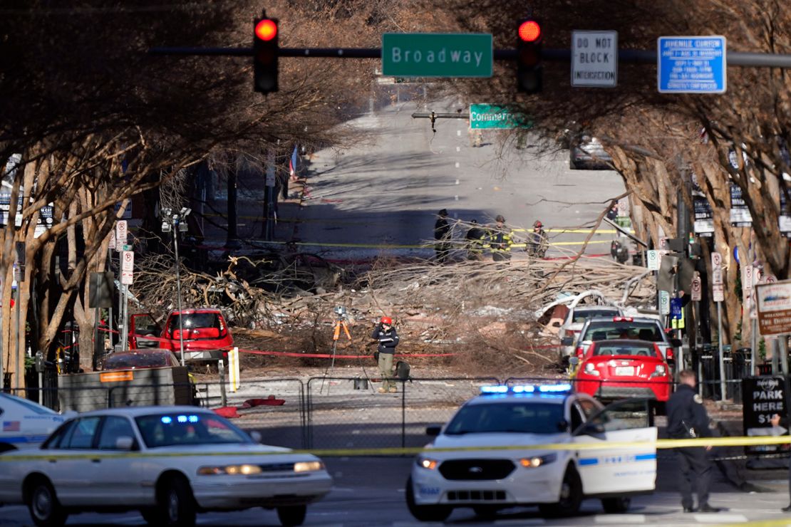 Investigators examine the site of the explosion in downtown Nashville on Sunday, December 27. 