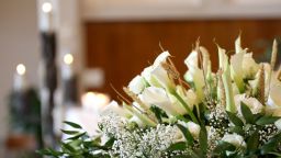 underscored flowers candles in church final expense life insurance