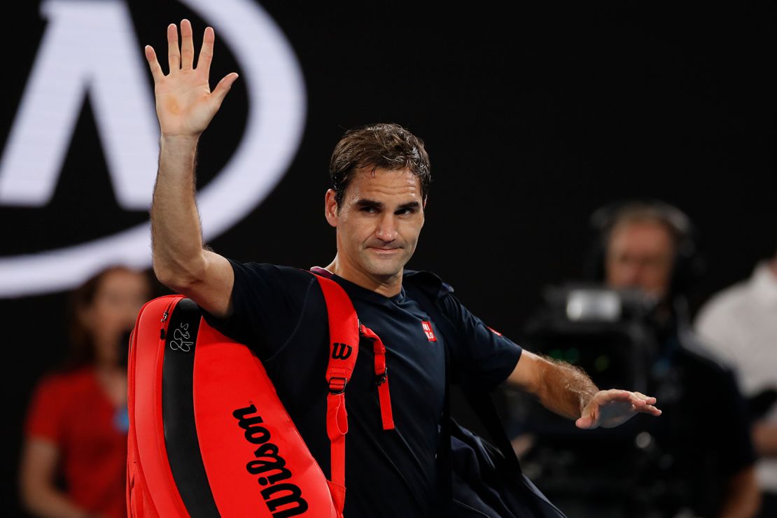 Federer acknowledges the crowd as he walks off court after losing against Djokovic at the Australian Open earlier this year.