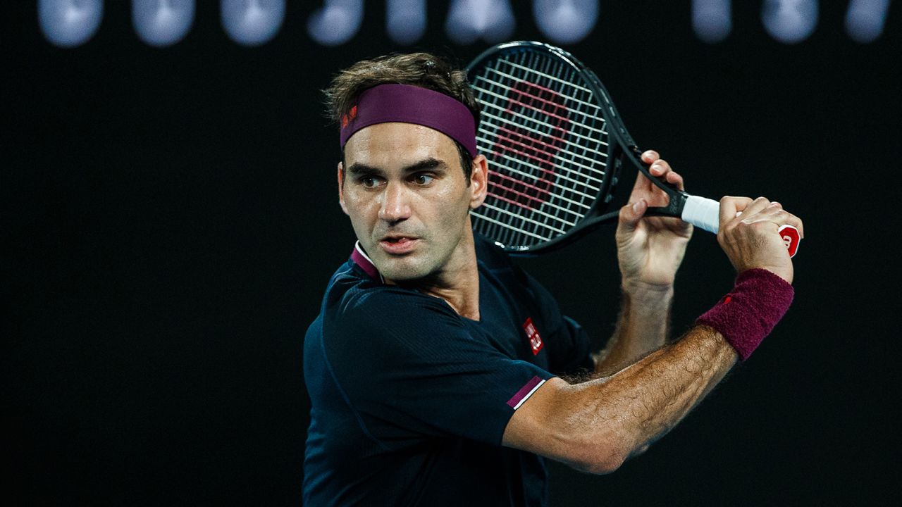 Federer plays a backhand in his semifinal match against Novak Djokovic on day 11 of the 2020 Australian Open at Melbourne Park on January 30, 2020 in Melbourne, Australia.