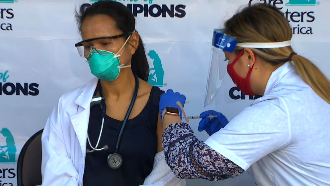 Physician's assistant Christy Carmichael receives the coronavirus vaccine on Monday.