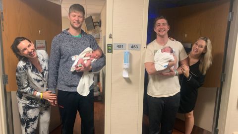 Ashley and John Carruth and Joe and Brittany Schille (left to right) hold their newborn sons.