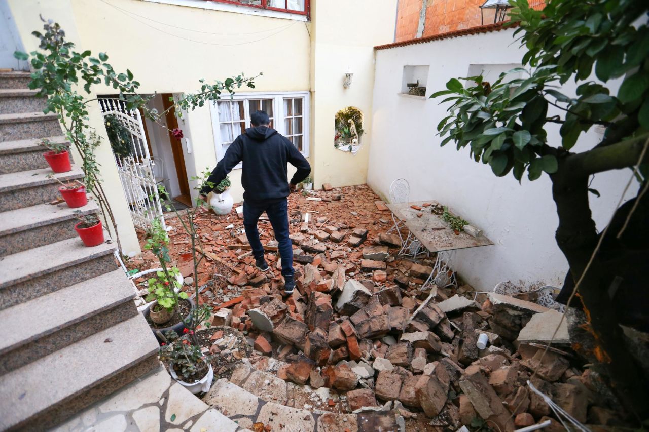 A man in Zagreb, Croatia, walks over debris after an earthquake on Tuesday, December 29. <a href="https://www.cnn.com/2020/12/29/europe/croatia-earthquake-6-3-magnitude-petrinja-intl/index.html" target="_blank">The 6.4 magnitude earthquake,</a> which struck about 30 miles southeast of Zagreb, could be felt across the Balkans. At least seven people were killed and dozens were injured.