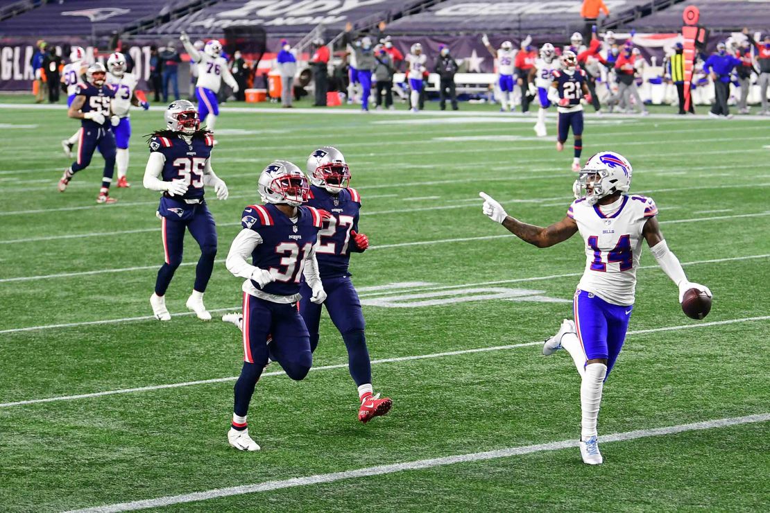 Diggs taunts New England Patriots defenders as he runs into the end zone for a touchdown.