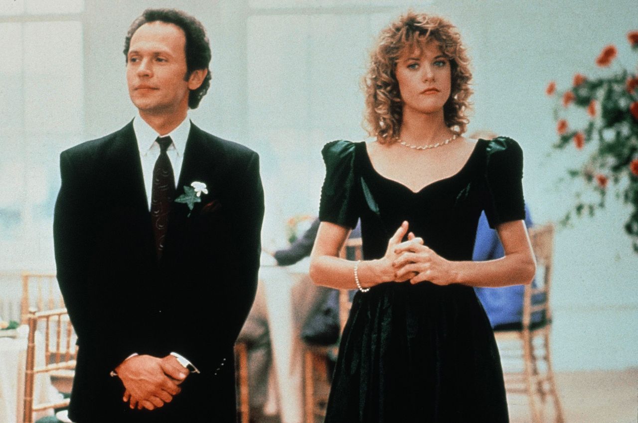 Billy Crystal (left) and Meg Ryan (right) star in the 1989 romantic comedy "When Harry Met Sally"; here they're shown in a wedding scene.