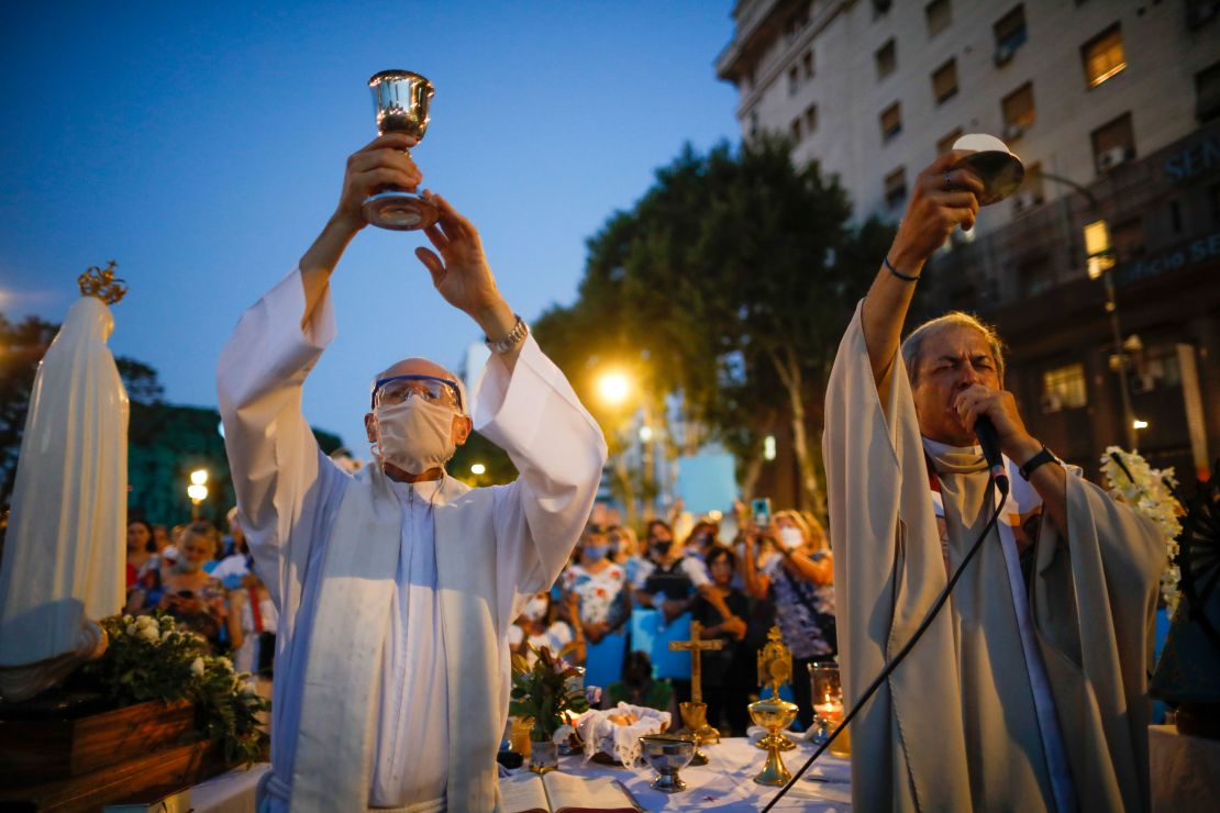 Catholic priests hold a mass during an anti-abortion protest as lawmakers debated its legalization, outside Congress in Buenos Aires on Tuesday.