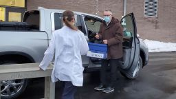 Dr. Richard Bates drove three hours to deliver a cooler holding 130 doses of the Covid-19 vaccine to the hospital in rural Alpena, Michigan.