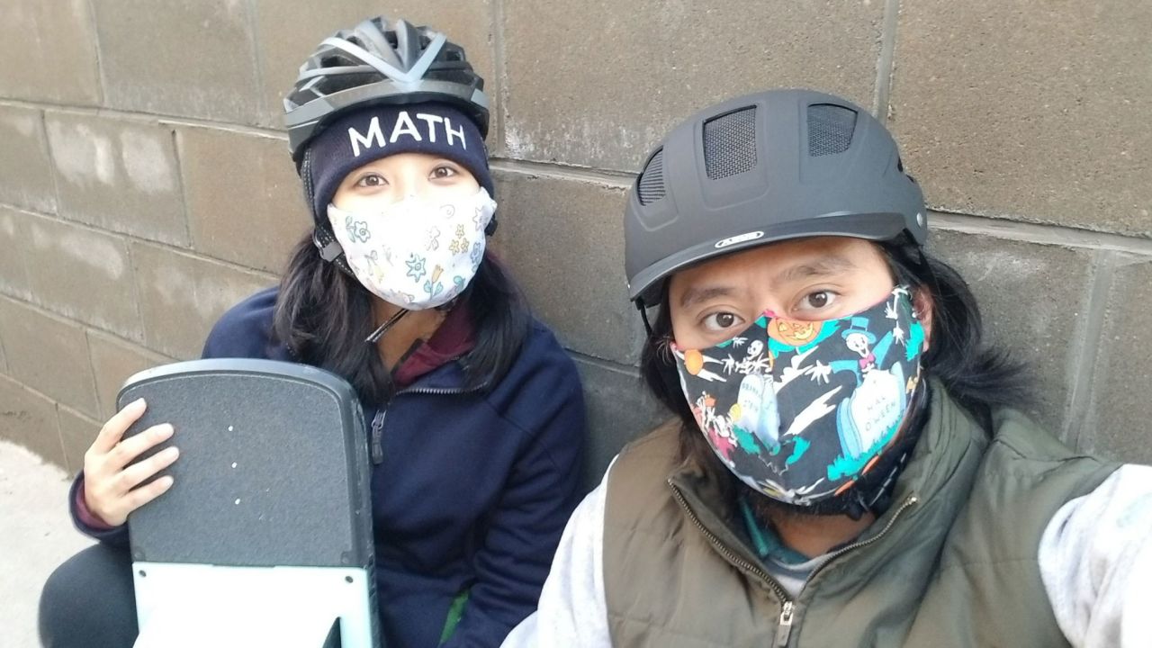 John Tabaniag, Ochoa-Celano's son, wearing a mask made from his mother's old nursing scrubs