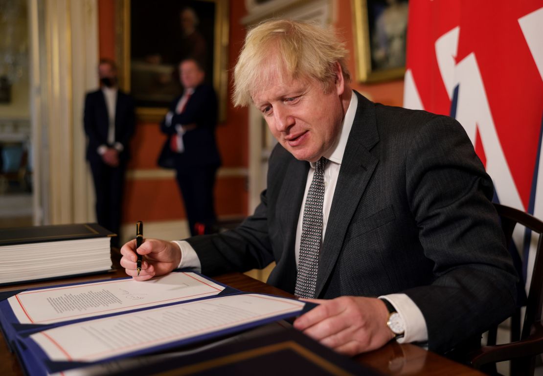 UK Prime Minister Boris Johnson signs the Brexit trade deal with the EU on December 30.