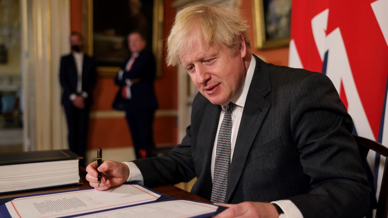 UK Prime Minister Boris Johnson signs the Brexit trade deal with the EU on December 30.