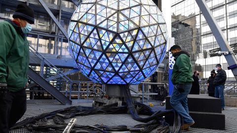 The world famous Times Square crystal ball is illuminated and elevated for a final test, a day ahead of the New Year's Eve celebrations at Time Square, on December 30, 2020, in New York City.
