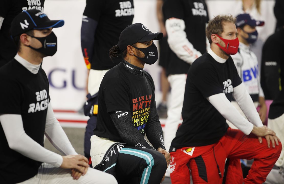Hamilton along with some of his fellow F1 drivers take a knee on the grid in support of the Black Lives Matter movement prior to the F1 Grand Prix of Bahrain.