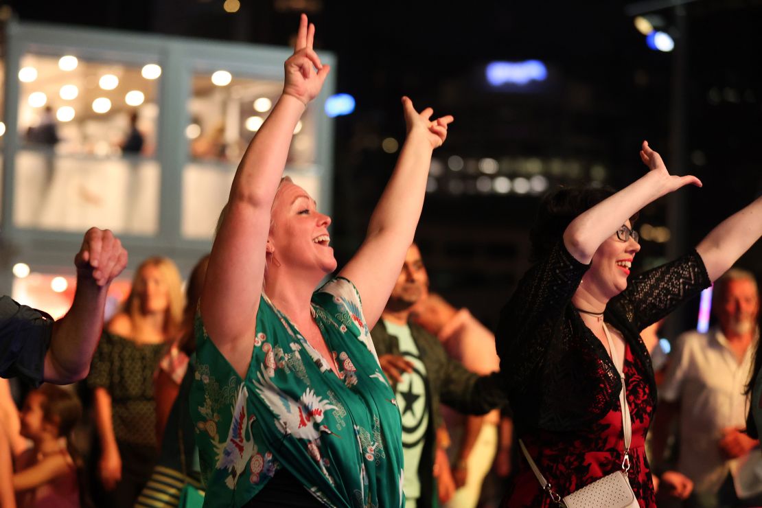 People enjoy the music in the Americas Cup Village during New Year's Eve celebrations  in Auckland, New Zealand, on December 31, 2020.